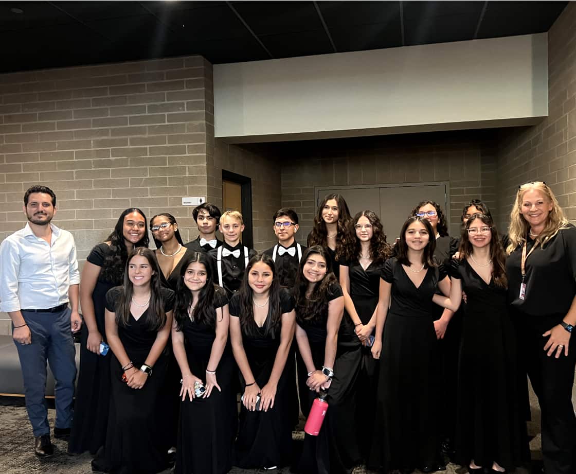 Large group of choir students posing for a picture