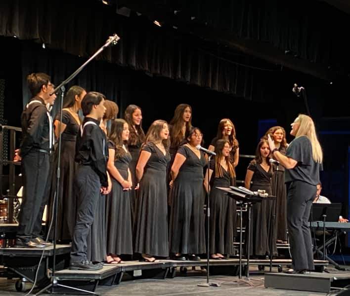 Choir students on stage at a performance