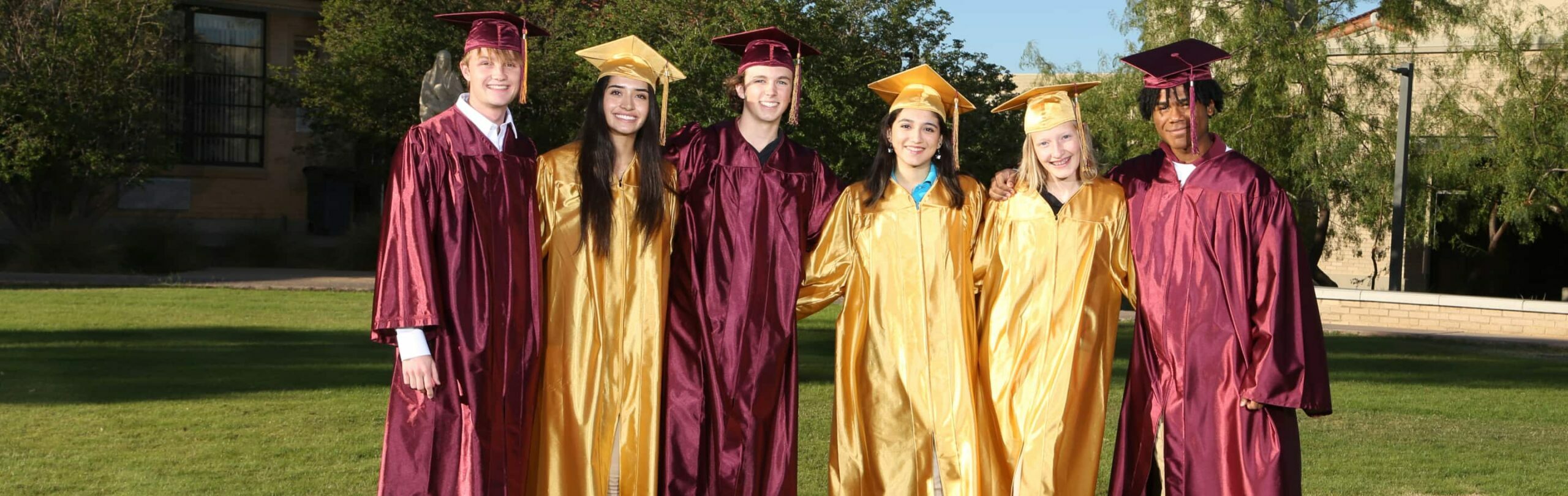 Students at graduation in their cap and gown