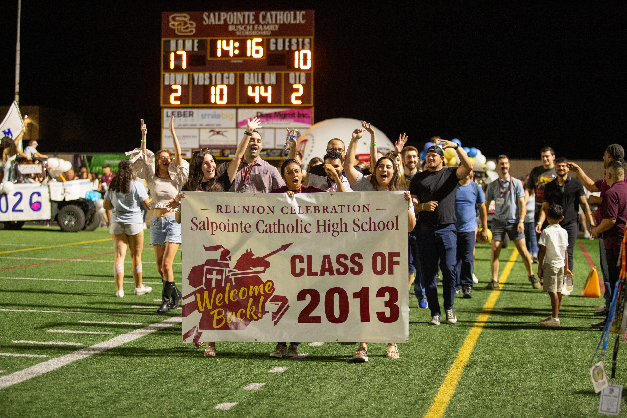 2013 graduates holding banner