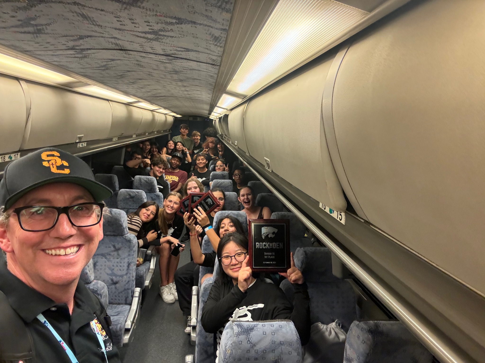 Jim Howell and Students on bus marching band